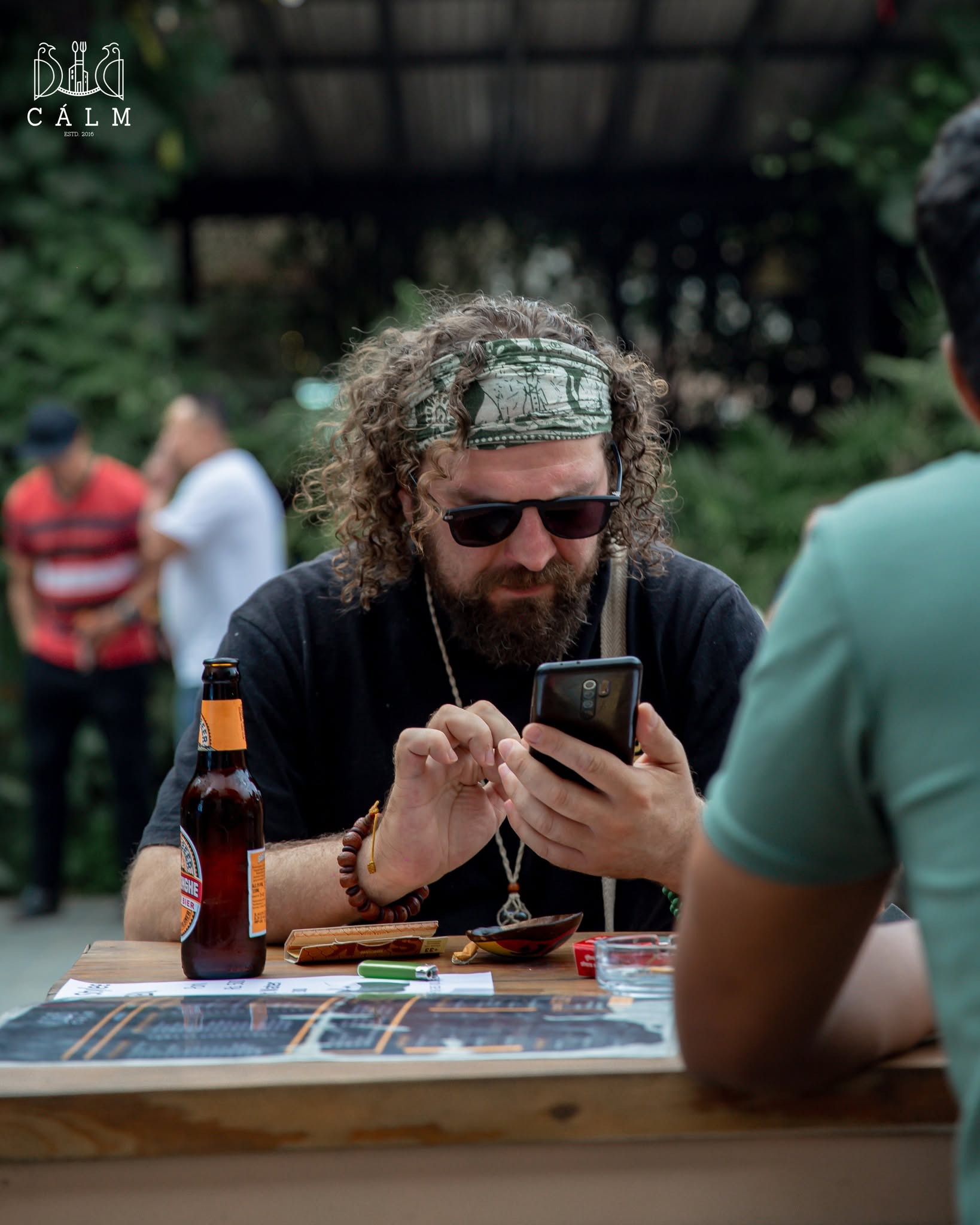 Guest relaxing at a garden table