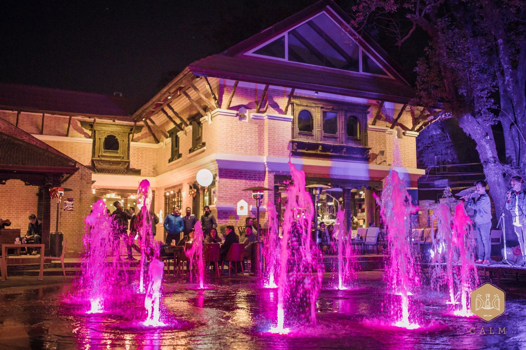 Calm courtyard with illuminated fountains